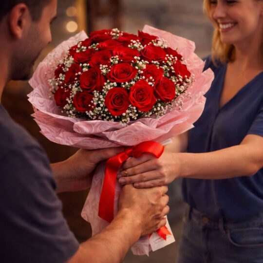 Large red rose bouquet with baby’s breath in pink and cream wrap, handcrafted for romantic gifting and flower delivery in Bangalore