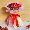 Large red rose bouquet with baby’s breath in pink and cream wrap, handcrafted for romantic gifting and flower delivery in Bangalore