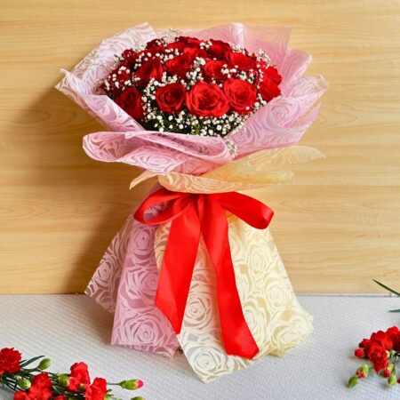 Large red rose bouquet with baby’s breath in pink and cream wrap, handcrafted for romantic gifting and flower delivery in Bangalore