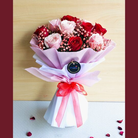 Pink and red roses bouquet wrapped in pastel paper with a red ribbon, Fresh Knots romantic flower bouquet for gifting and same-day delivery in Bangalore.