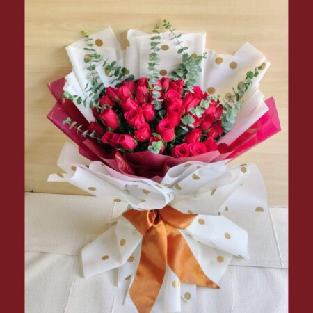 Fresh red rose bouquet with eucalyptus greens, flower delivery in Bangalore by FreshKnots.