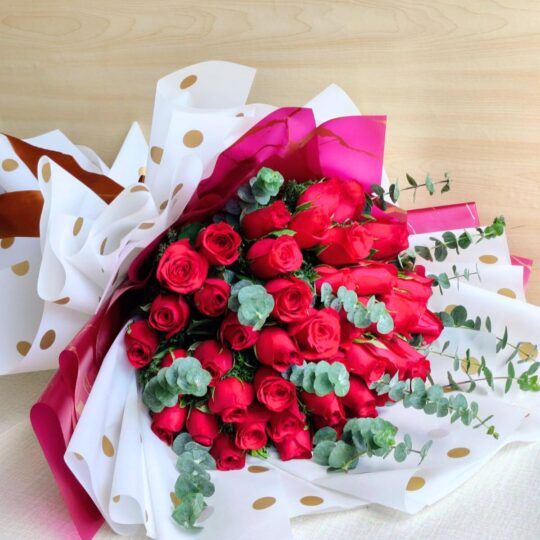 Fresh red rose bouquet with eucalyptus greens, flower delivery in Bangalore by FreshKnots.