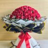 Luxury bouquet of 100 fresh red roses with white fillers, handcrafted by FreshKnots Bangalore.