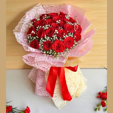 Large red rose bouquet with baby’s breath in pink and cream wrap, handcrafted for romantic gifting and flower delivery in Bangalore.