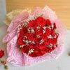 Large red rose bouquet with baby’s breath in pink and cream wrap, handcrafted for romantic gifting and flower delivery in Bangalore