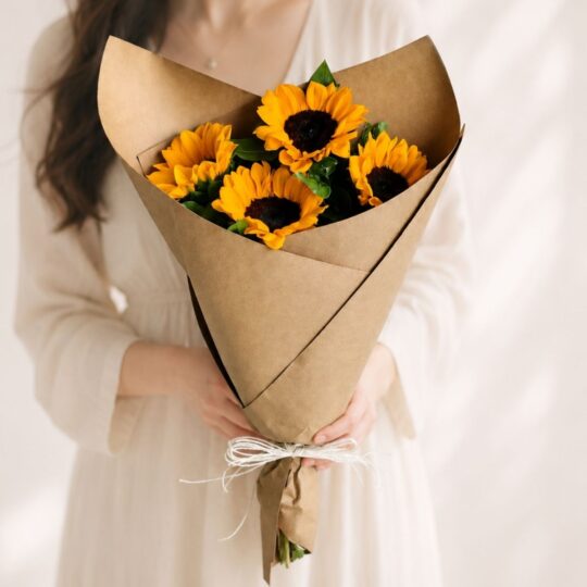 Fresh sunflower bouquet wrapped in brown kraft paper by premium florist in Bangalore