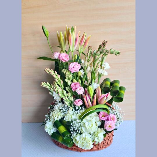 Elegant flower basket with lilies, eustoma, hydrangea, and white blooms by premium florist in Bangalore