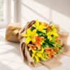 Fresh yellow and orange lily bouquet in jute wrap for same day flower delivery in Bangalore by FreshKnots