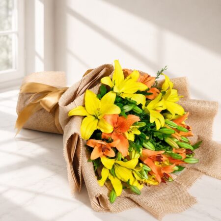 Fresh yellow and orange lily bouquet in jute wrap for same day flower delivery in Bangalore by FreshKnots