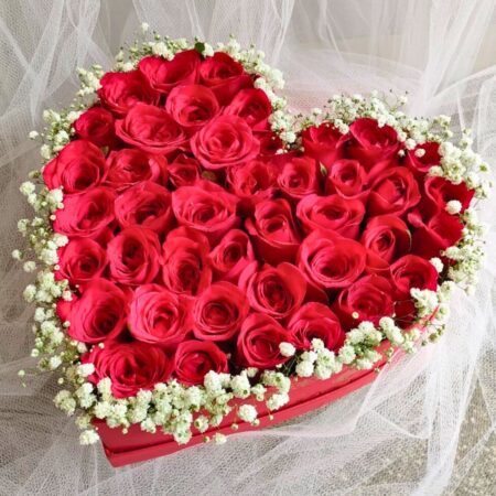 Heart-shaped red rose box with baby’s breath for romantic gifting - FreshKnots same-day flower delivery in Bangalore.