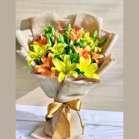 Fresh yellow and orange lily bouquet in jute wrap for same day flower delivery in Bangalore by FreshKnots