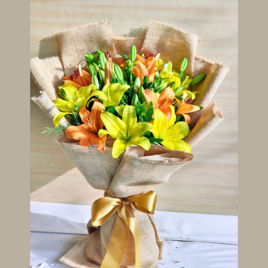 Fresh yellow and orange lily bouquet in jute wrap for same day flower delivery in Bangalore by FreshKnots