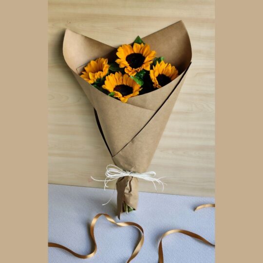 Fresh sunflower bouquet wrapped in brown kraft paper by premium florist in Bangalore