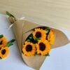 Fresh sunflower bouquet wrapped in brown kraft paper by premium florist in Bangalore