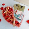 Heart-shaped box of fresh red roses with Belgian chocolates, Valentine flower delivery in Bangalore.