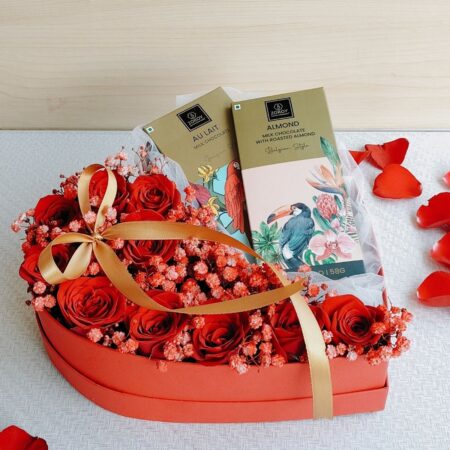 Heart-shaped box of fresh red roses with Belgian chocolates, Valentine flower delivery in Bangalore.