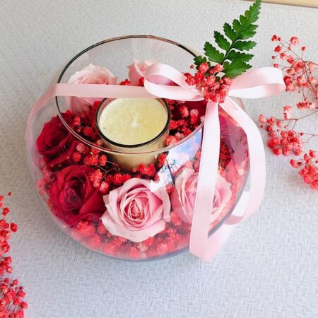 Rose and candle glass bowl arrangement for same day flower delivery in Bangalore by FreshKnots