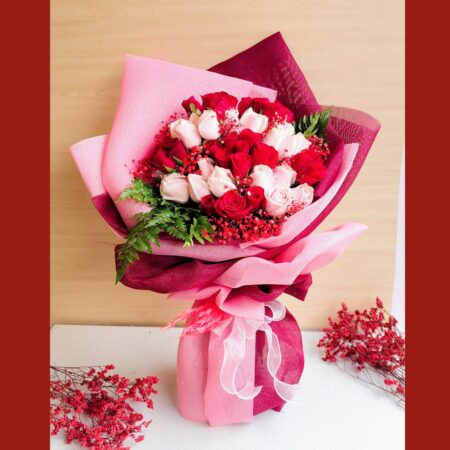 Luxurious red and pink rose bouquet by FreshKnots with same-day flower delivery in Bangalore