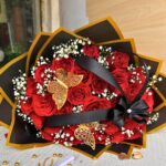 Luxury red rose Valentine bouquet with black and gold wrapping