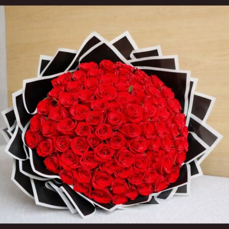 Luxury red rose bouquet with premium black wrapping by FreshKnots, ideal for same day flower delivery and romantic gifting in Bangalore.