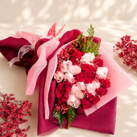Luxurious red and pink rose bouquet by FreshKnots with same-day flower delivery in Bangalore