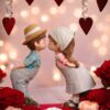Romantic couple figurine with red rose flower arrangement for Valentine’s Day delivery in Bangalore