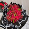 Luxury red rose bouquet for Valentine’s Day with premium black wrapping, fresh flower delivery in Bangalore by FreshKnots