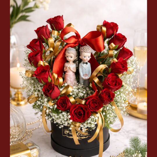 Premium red rose heart arrangement with couple figurines by Bangalore florist