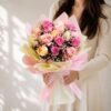Fresh pastel rose bouquet wrapped in pink and cream paper for same day flower delivery in Bangalore by FreshKnots