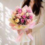 Fresh pastel rose bouquet wrapped in pink and cream paper for same day flower delivery in Bangalore by FreshKnots