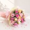Fresh pastel rose bouquet wrapped in pink and cream paper for same day flower delivery in Bangalore by FreshKnots