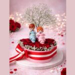 Heart shaped Valentine rose box with couple figurine for romantic gifting in Bangalore