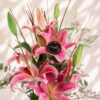 Premium pink lilies in glass vase arrangement with fresh flowers for luxury flower delivery in Bangalore.