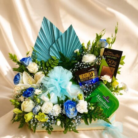 Luxury cake and flower hamper with fresh flowers and gourmet treats for premium gifting in Bangalore.