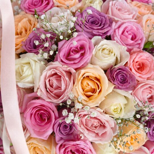 Basket of 100 pastel roses in a wicker basket – luxury flower delivery Bangalore, same day flowers