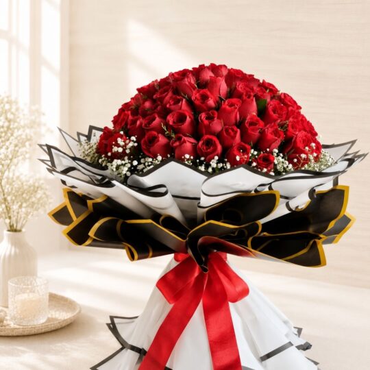 Luxury bouquet of 100 fresh red roses with white fillers, handcrafted by FreshKnots Bangalore.
