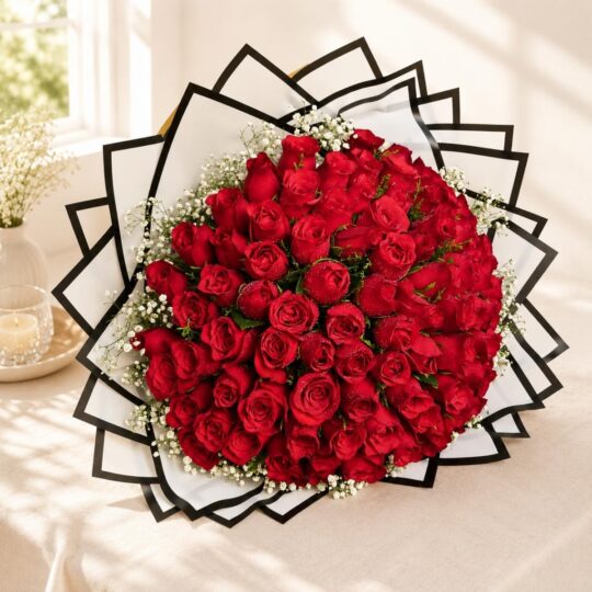 Luxury bouquet of 100 fresh red roses with white fillers, handcrafted by FreshKnots Bangalore.