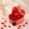 Luxury heart-shaped flower box with fresh red roses and red lily for Valentine's Day, anniversary and romantic flower delivery in Bangalore.