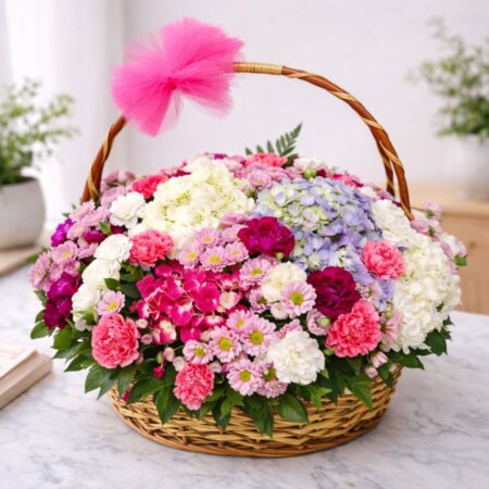 Pastel flower basket with hydrangeas, carnations and seasonal blooms in a wicker basket - same day flower delivery Bangalore