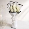 A bouquet of fresh white roses wrapped in elegant white paper with a satin bow — available for same day flower delivery in Bangalore.