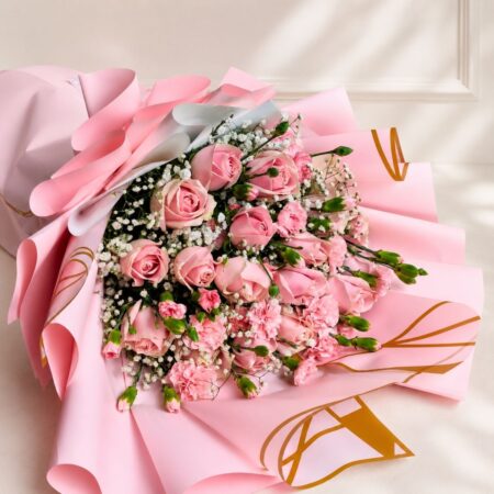 Soft pink rose bouquet with baby’s breath and delicate fillers, wrapped in pastel pink paper for an elegant floral gift