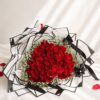 Red rose bouquet with white fillers for Valentine’s Day flower delivery in Bangalore by FreshKnots