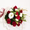 Red and white fresh flower bouquet of roses and eustoma (exotic flower) wrapped in marble paper with satin ribbon.
