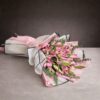 Luxury pink lily and rose hand-tied bouquet with pastel wrapping and satin ribbon, premium fresh flower arrangement for birthday and anniversary gift.