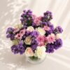 Luxury purple and pink flower bouquet with roses, chrysanthemums and carnations in glass vase - fresh flower delivery in Bangalore