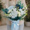 Luxury blue orchid and white hydrangea bouquet with premium blooms for online flower delivery in Bangalore.