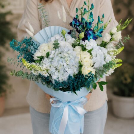 Luxury blue orchid and white hydrangea bouquet with premium blooms for online flower delivery in Bangalore.