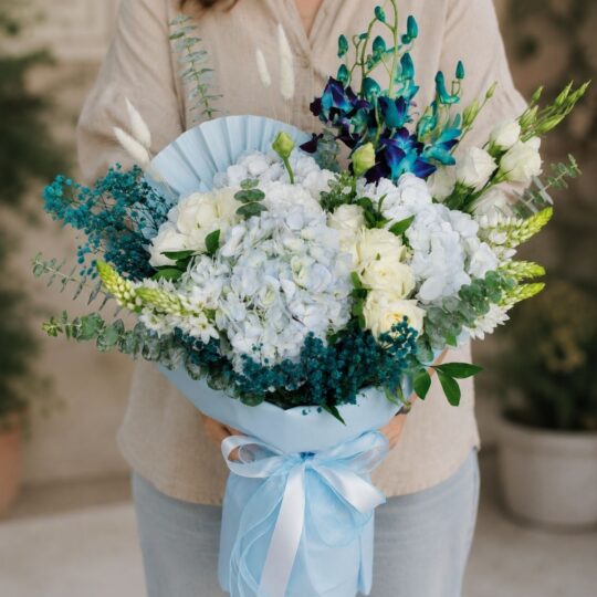Luxury blue orchid and white hydrangea bouquet with premium blooms for online flower delivery in Bangalore.