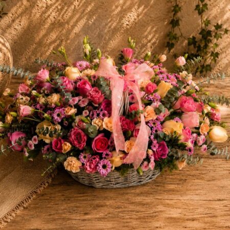 Premium pink and peach floral basket arrangement for online flower delivery in Bangalore.