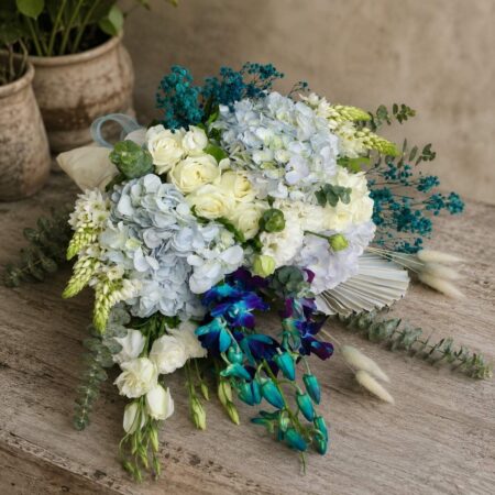 Luxury blue orchid and white hydrangea bouquet with premium blooms for online flower delivery in Bangalore.